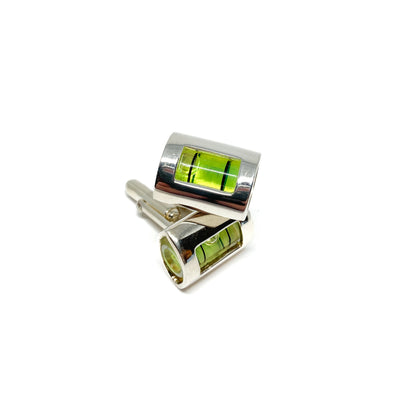 A pair of silver-toned MRCUFF Level Green Liquid Construction Cufflinks featuring miniature spirit levels with vibrant green liquid and air bubbles.