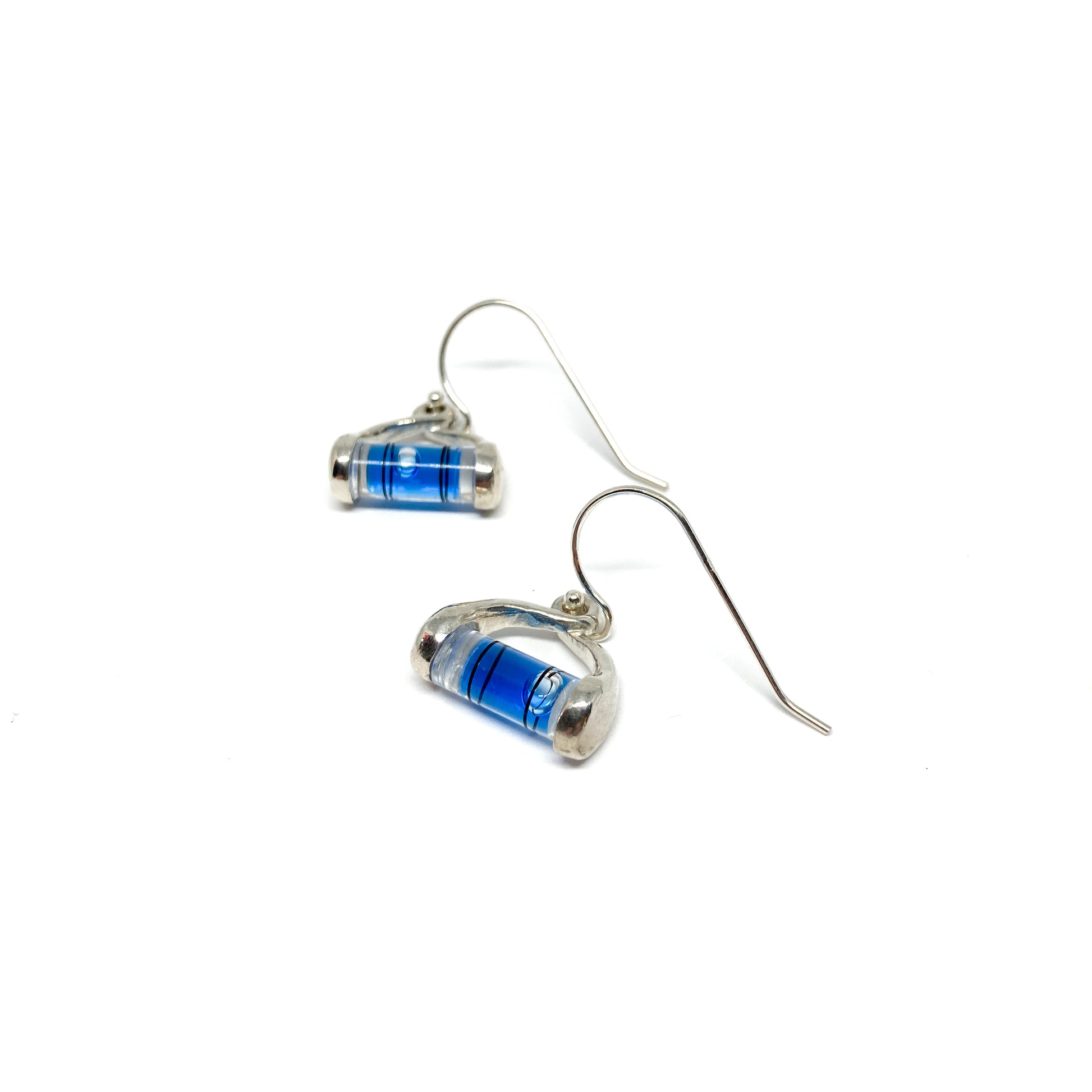 Silver dangle earrings shaped like miniature levels with blue liquid and a centered clear bubble.
