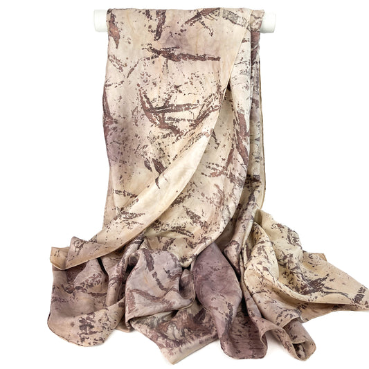 Draped Silk Blanket Scarf with an abstract, nature-inspired pattern and a soft, flowing texture.