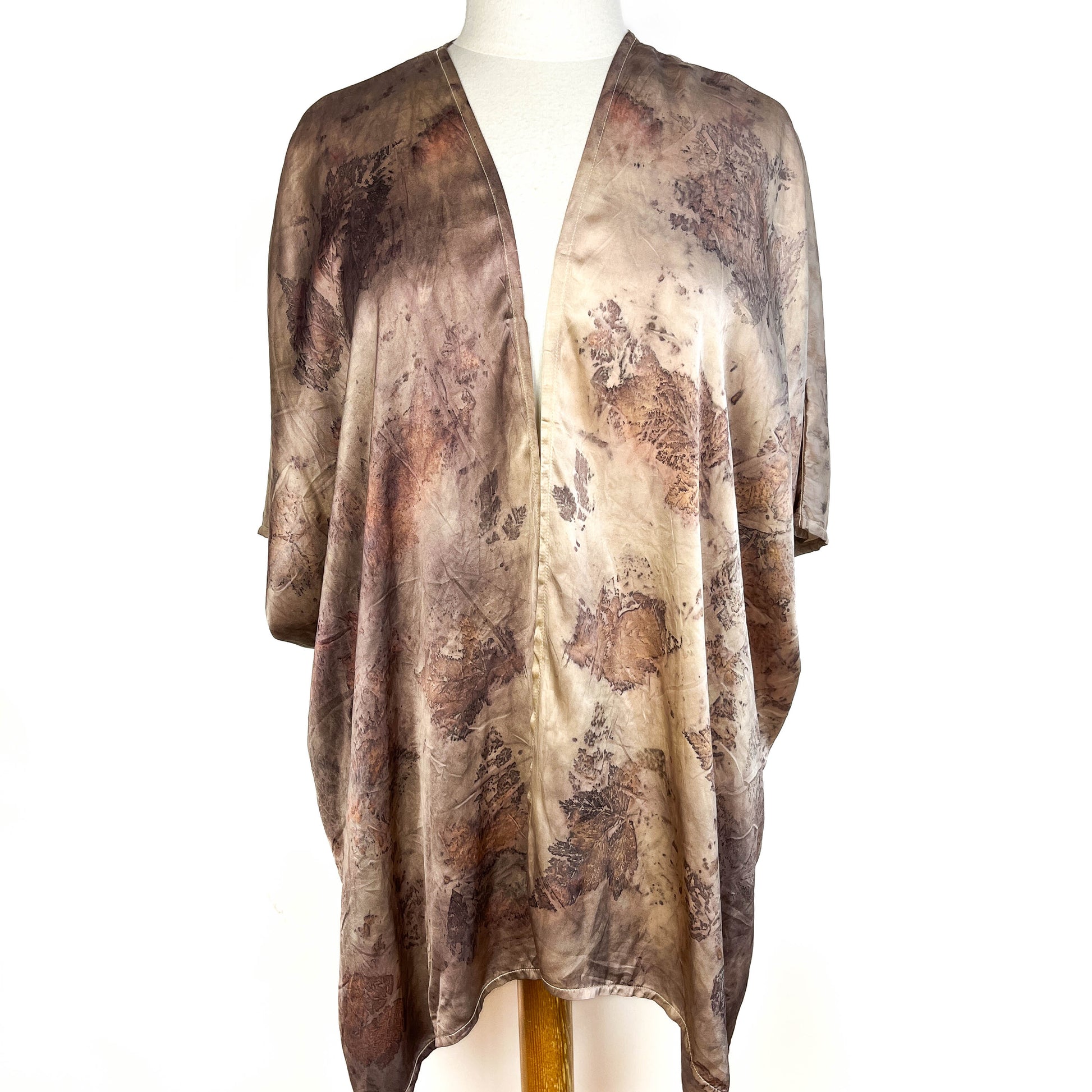Short Silk Cardigan with open front design and botanical print in soft earth tones and natural textures.