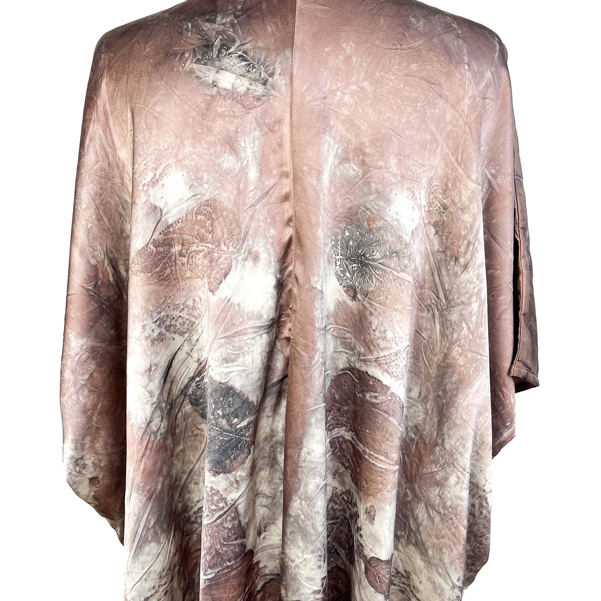 Back of Short Silk Cardigan with allover botanical motifs and center seam for a flowing silhouette.