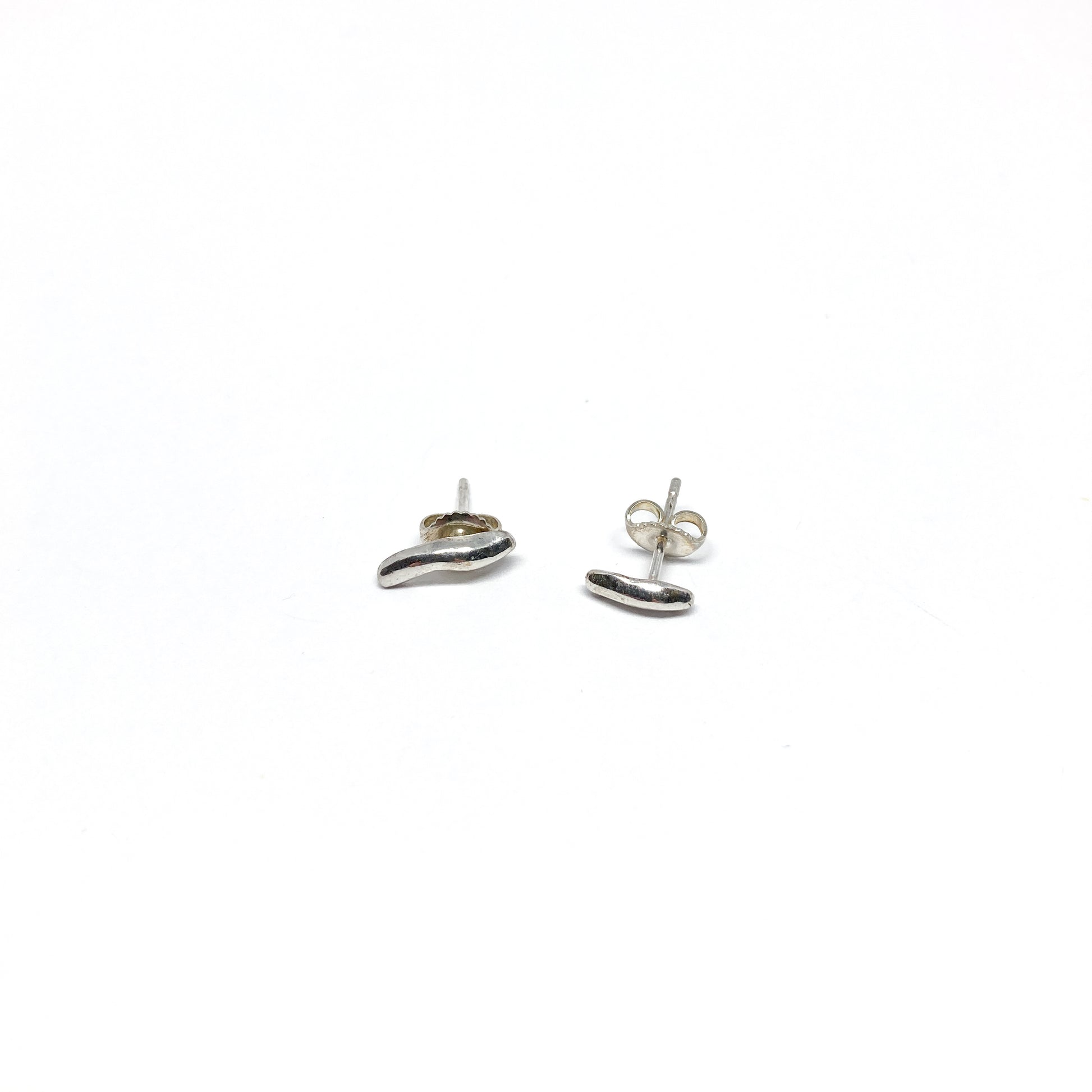 Silver organic stud earrings.