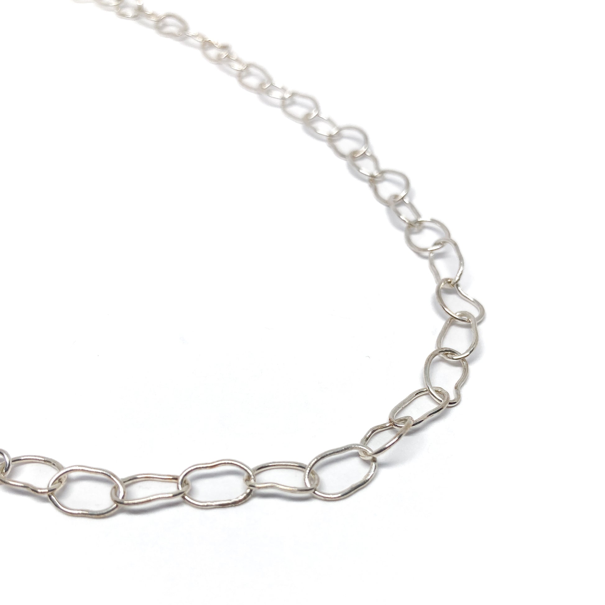 Silver oval link necklace close up.