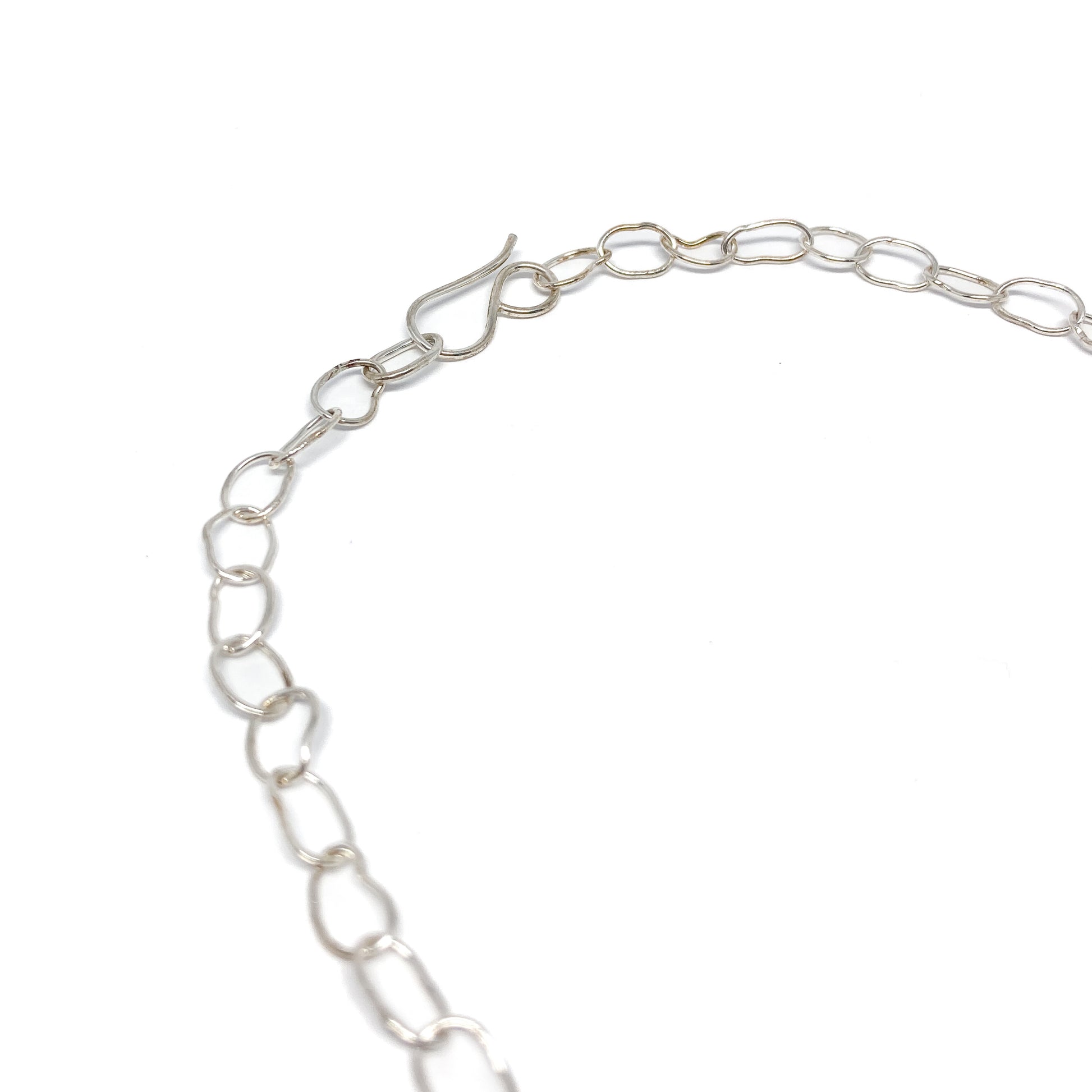 Silver oval link necklace close up.