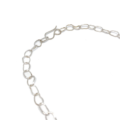 Silver oval link necklace close up.