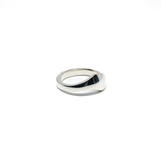 Modern silver ring with a smooth, curved design.