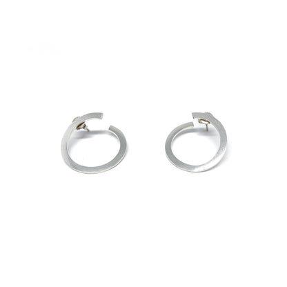 Modern silver hoop earrings, open design.