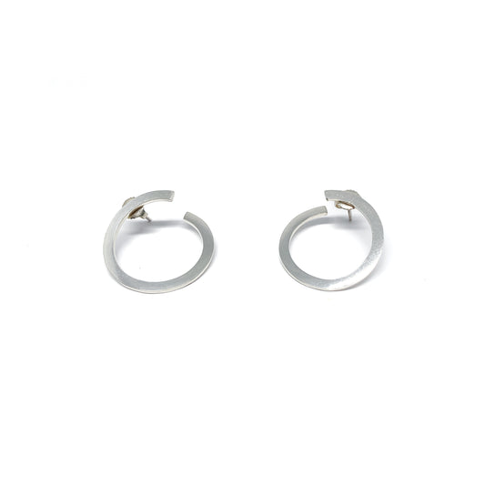 Modern silver hoop earrings, open design.