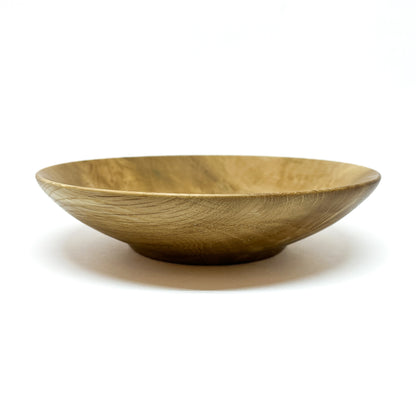 A side view of a Rare Garry Oak Candy Dish, highlighting its elegant, curved form.