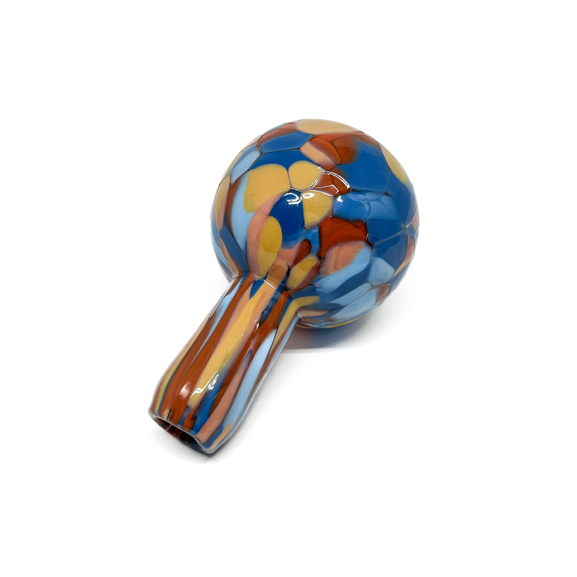 Side angle of Blue & Orange Mini Vase laying down, showing curved shape and pattern.