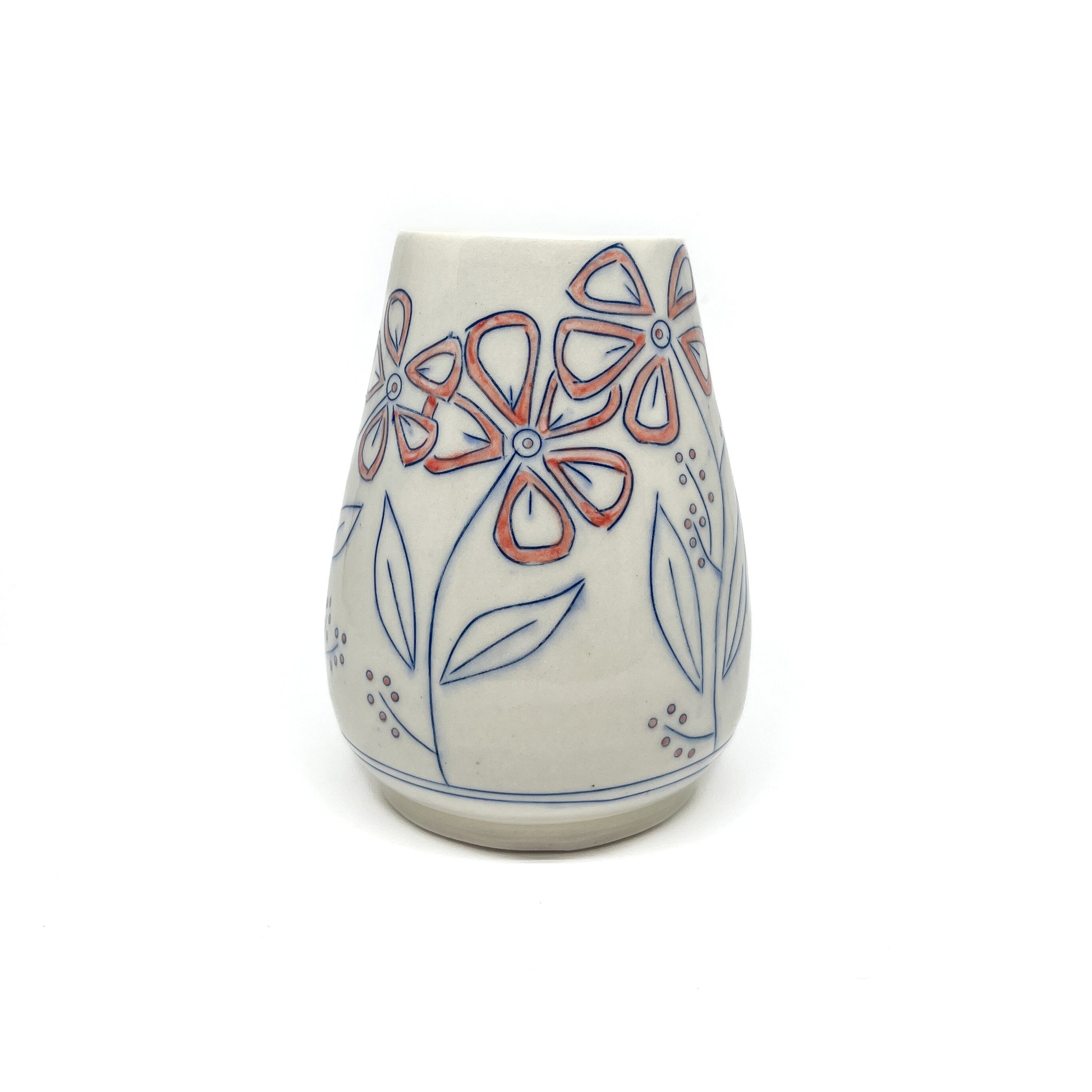 A white ceramic vase with a flared shape features hand-painted blue floral outlines with reddish-orange petal details and a light green inner glaze.