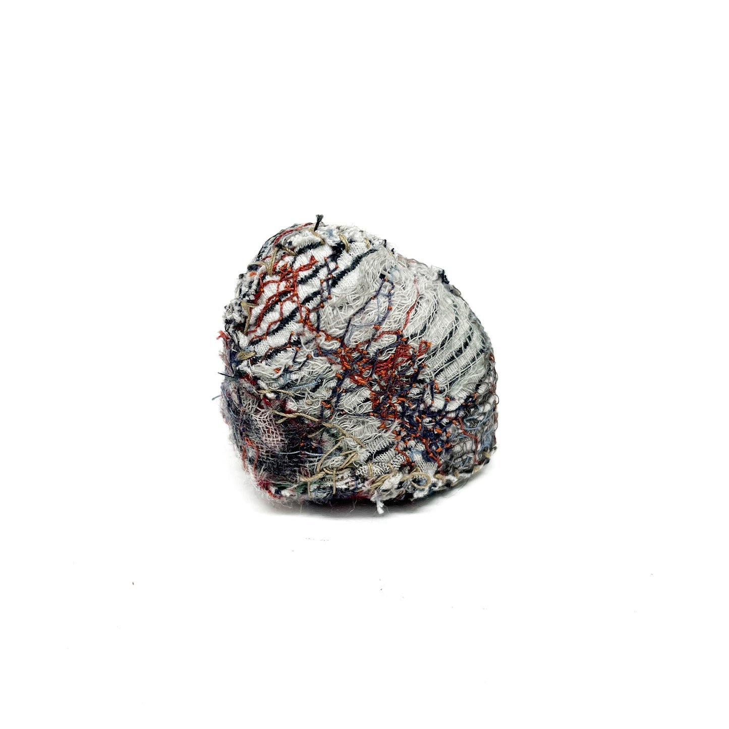 Embroidered Rock by Jane Kenyon: Round textured textile art resembling a rock, with dense gray and white thread stitching and subtle color accents.