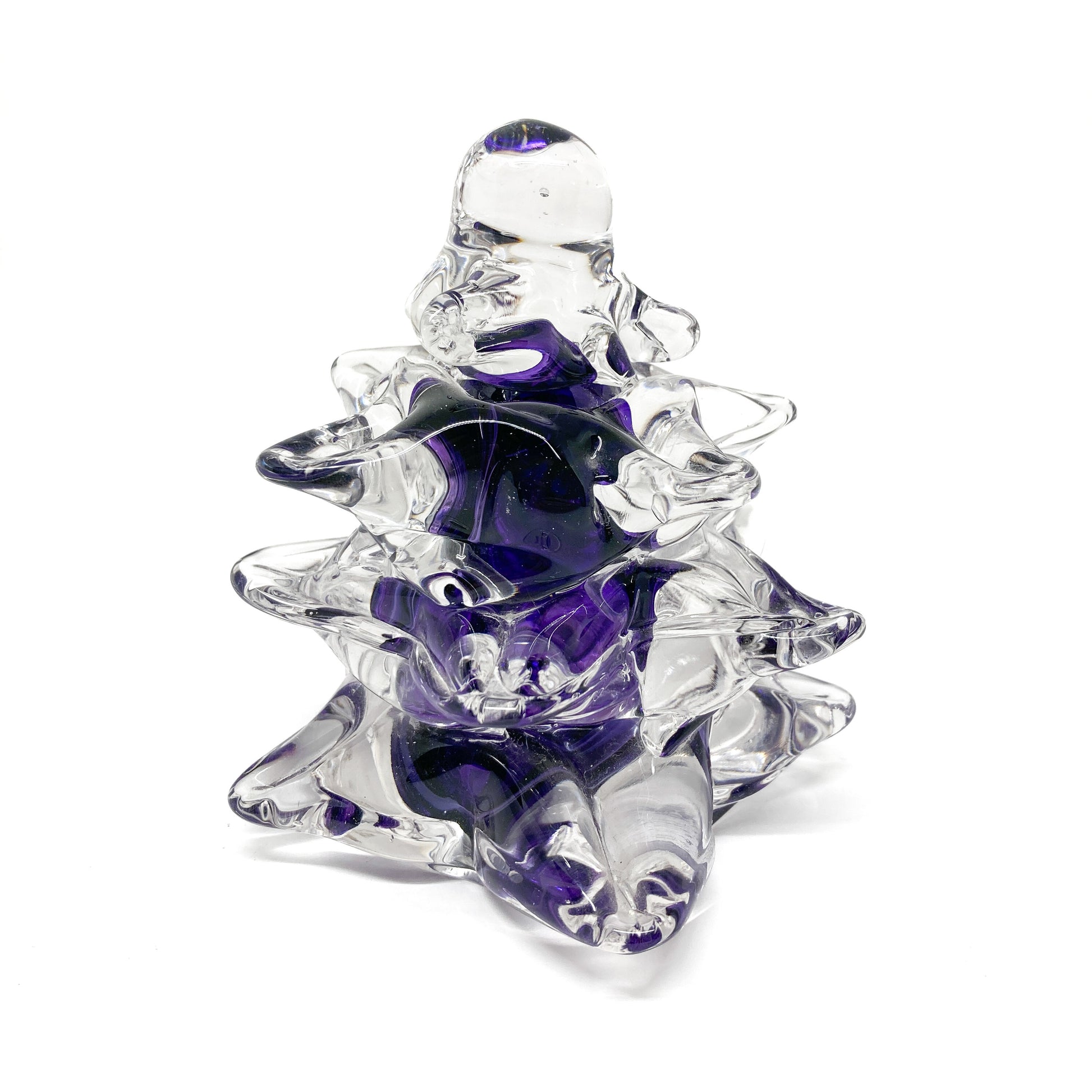 A medium, clear glass Christmas tree with purple swirls.