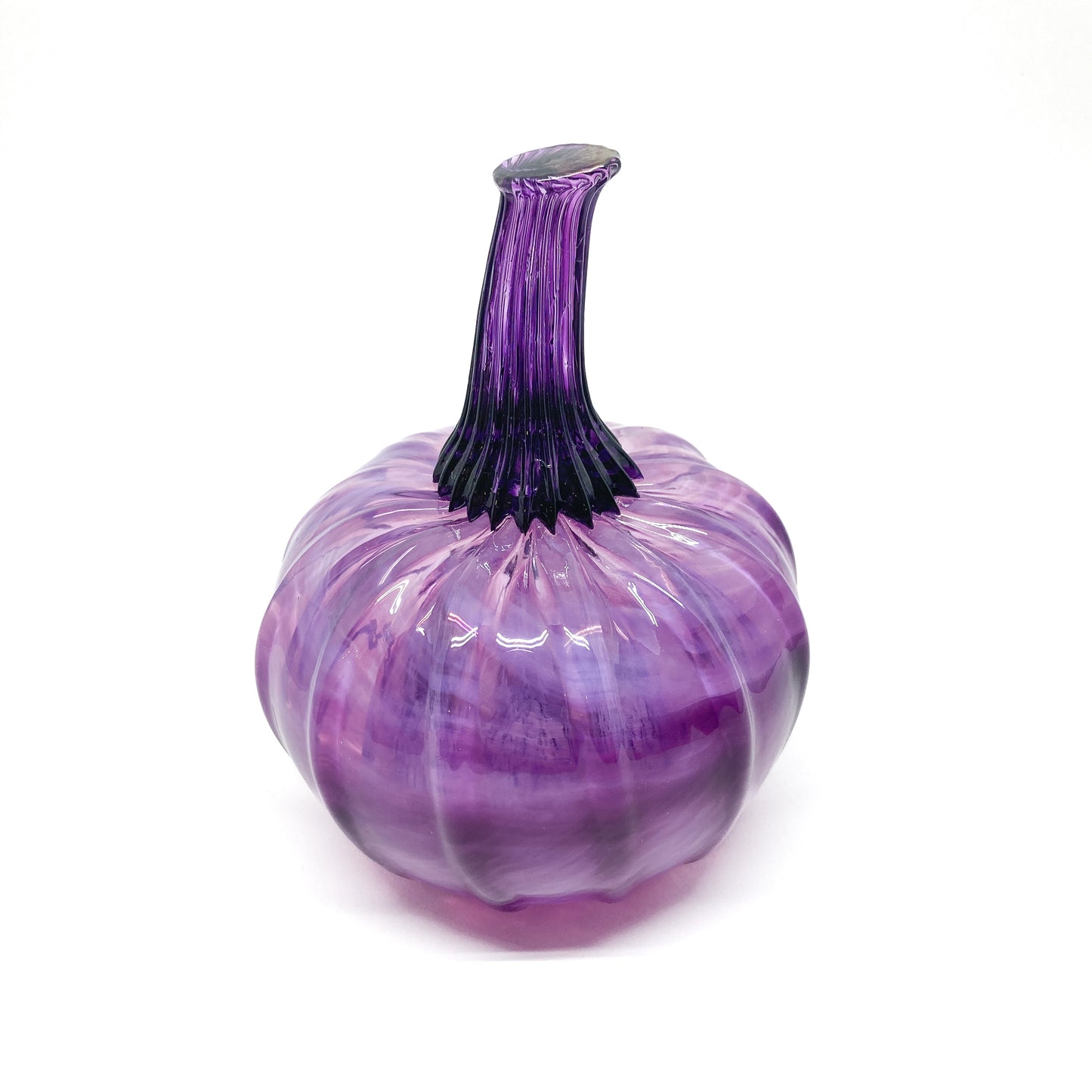 A purple glass pumpkin with a tall, ridged purple glass stem.