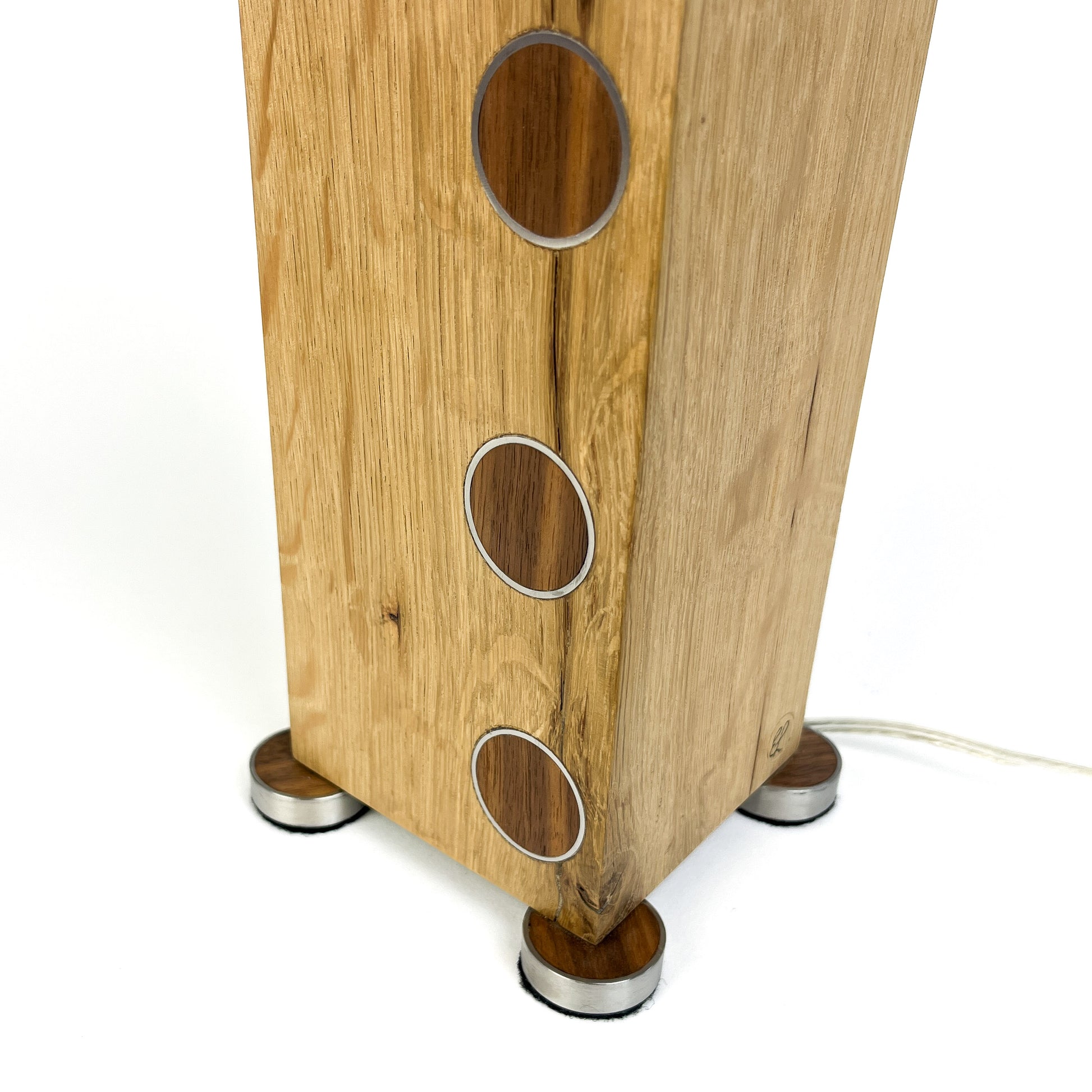 Lamp base: light wood block with metal circles, small metal feet, and a metal rod.