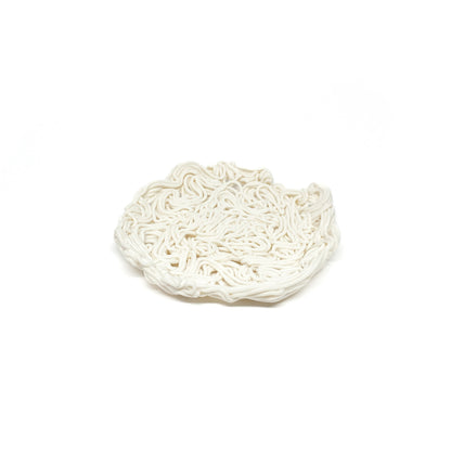 A textured, shallow, round spiral tealight holder made of ceramic with a dense, noodle-like pattern.