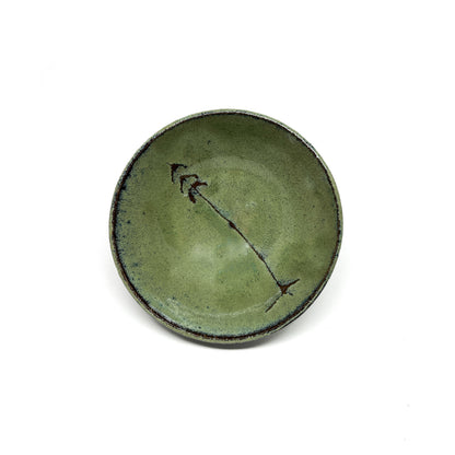 Green glazed terracotta bowl with tree design.