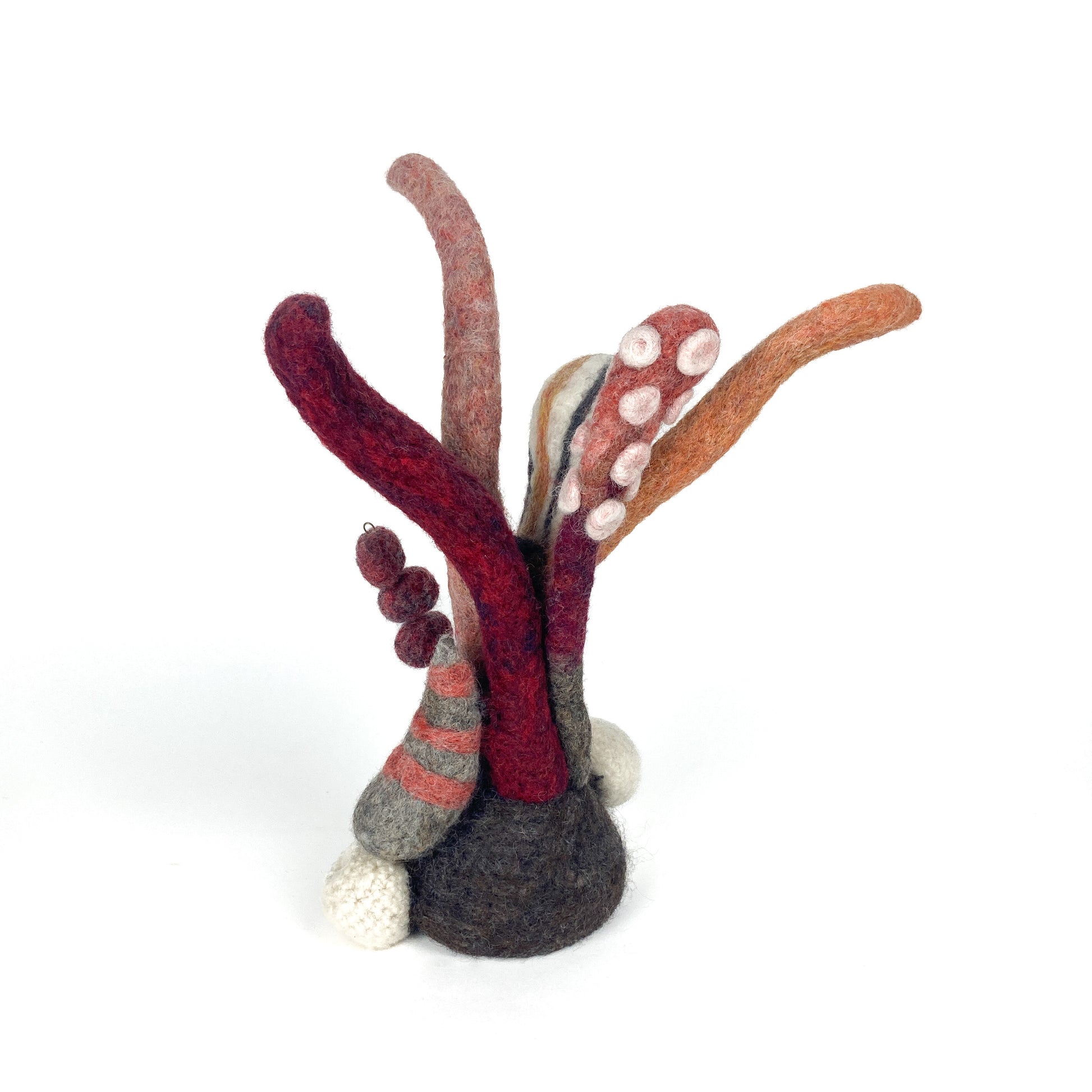 Felted wool art piece titled "Under the Sea Party" by Christina Norberg, featuring textured, organic shapes.