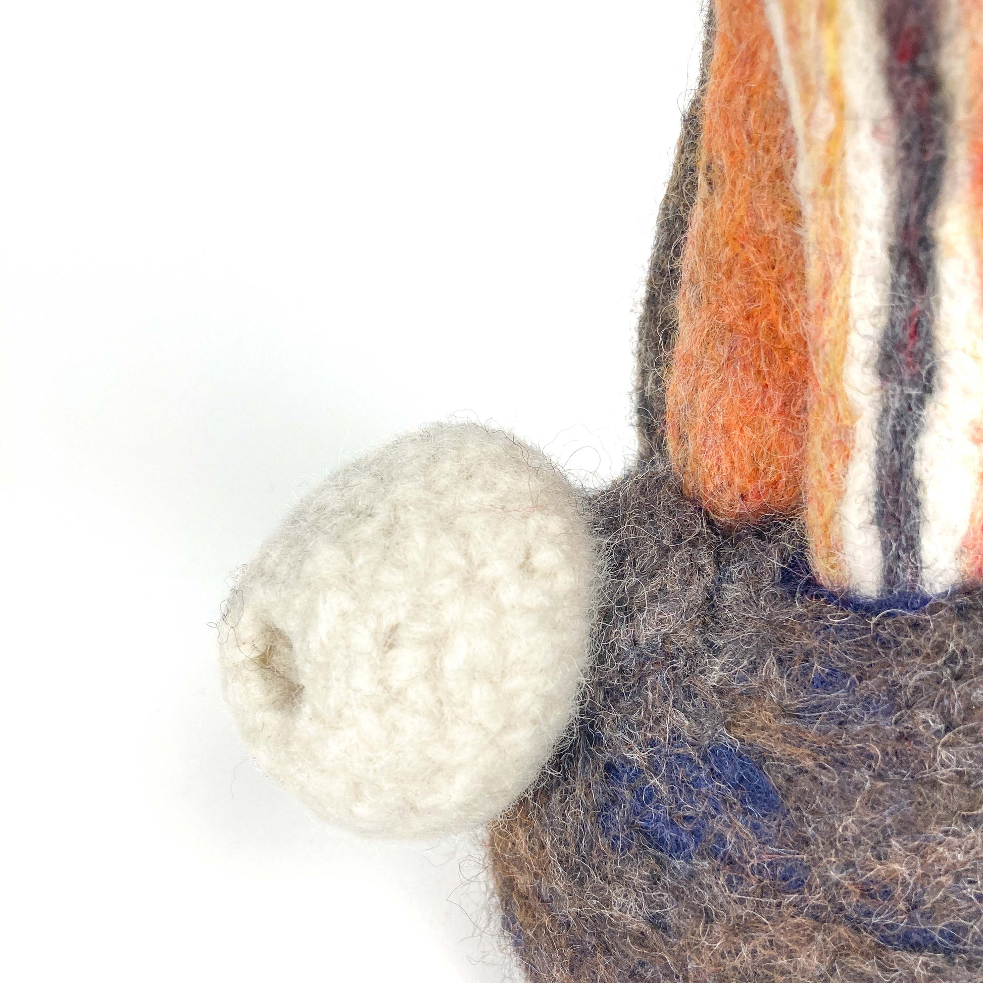 Close-up of the base of Christina Norberg's felted wool sculpture "Under the Sea Party," showing textured details.