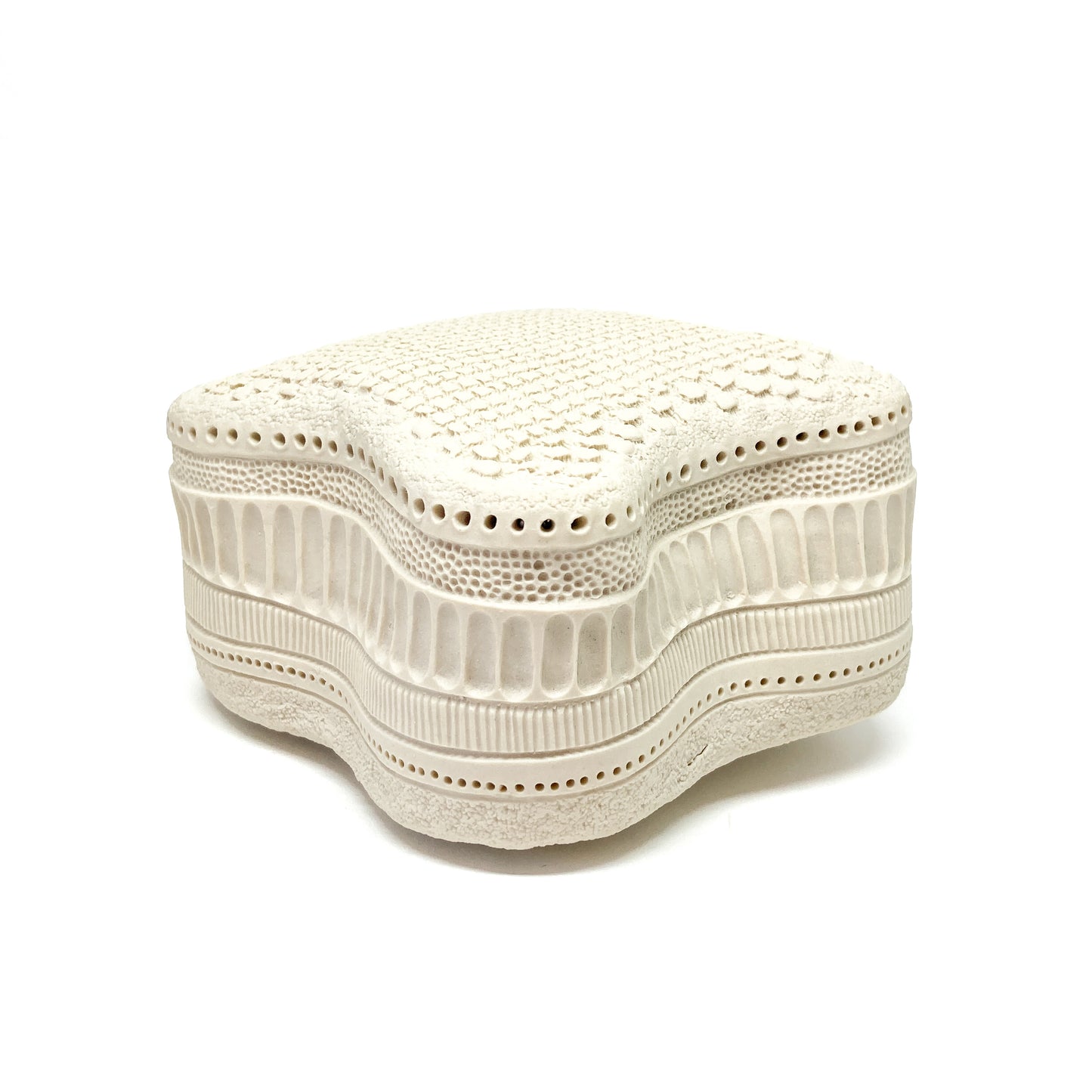 Wavy Amphitetras Elegans Sculpture with a porous, textured surface and intricate, layered patterns.