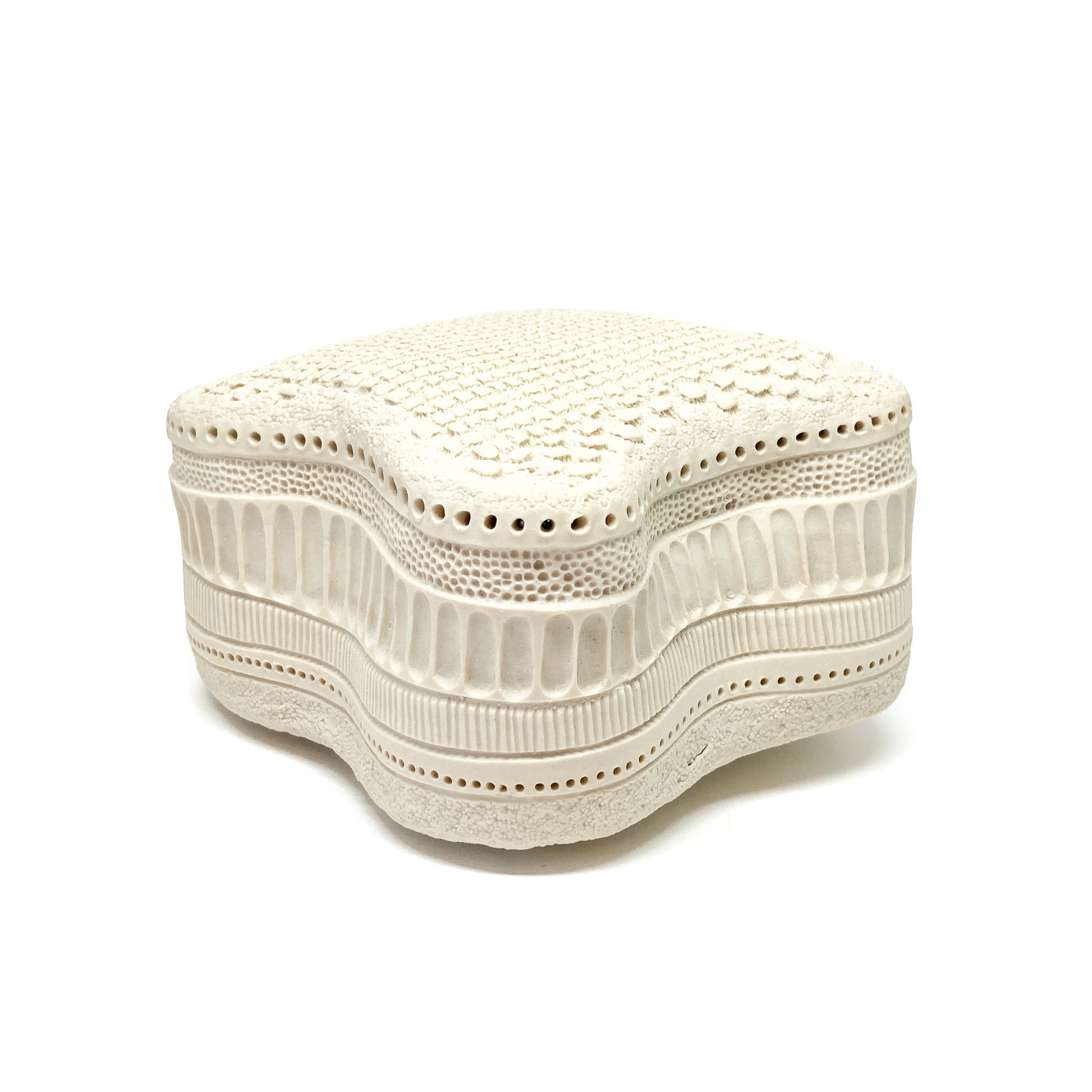 Wavy Amphitetras Elegans Sculpture with a porous, textured surface and intricate, layered patterns.