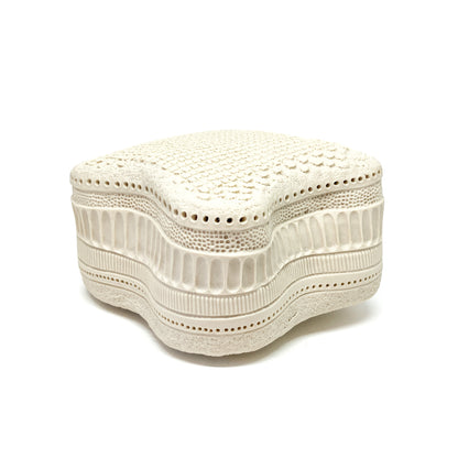 Wavy Amphitetras Elegans Sculpture with a porous, textured surface and intricate, layered patterns.