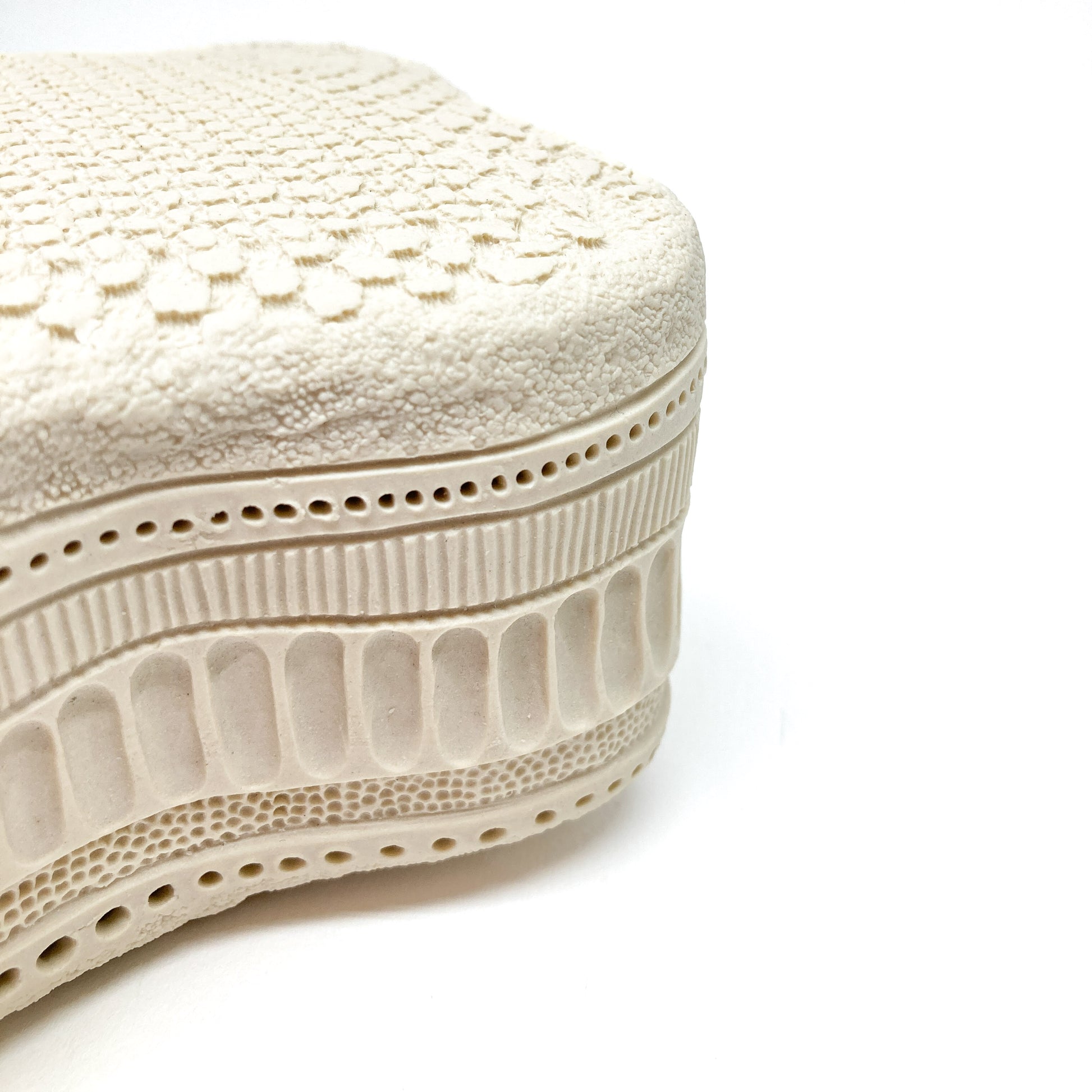 Textured Amphitetras Elegans Sculpture featuring layered, porous details and a unique, organic form.