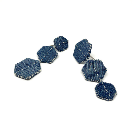 Denim "Patched Trio" earrings by Louise Perrone, featuring three connected hexagonal patches with white stitching.