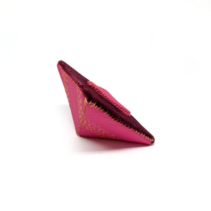 Side view of a "Flagged Elevensies" brooch showing its layered construction and textured fabric.