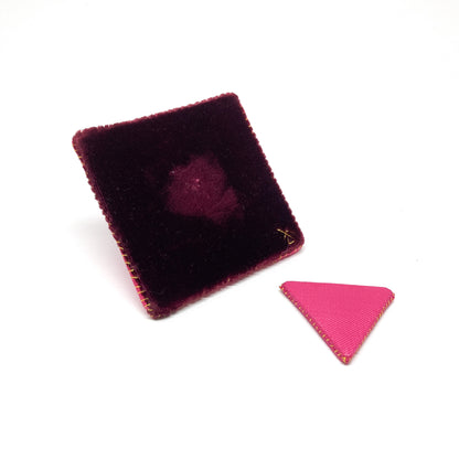 "Flagged Elevensies" brooch with the triangular flag detached from the square backing showing the pin.
