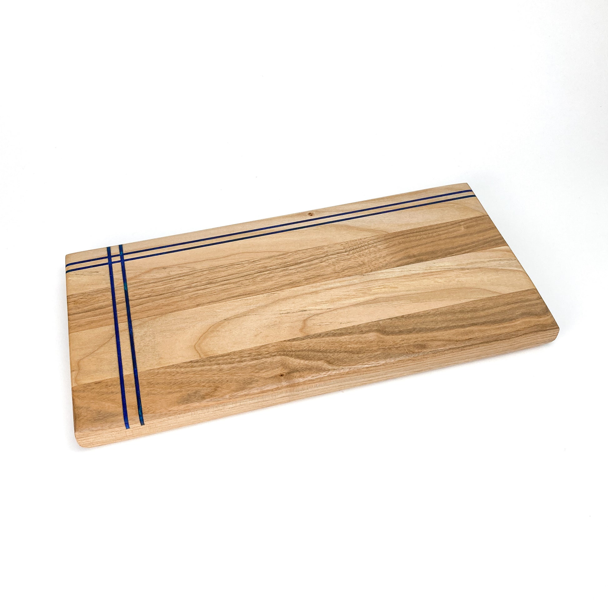 Butternut Railroad Charcuterie Board featuring three sleek blue resin inlays in a modern, minimalist layout.
