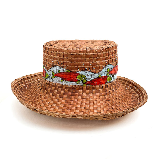 A woven hat with a cylindrical crown and wide brim, featuring a band with painted fish.