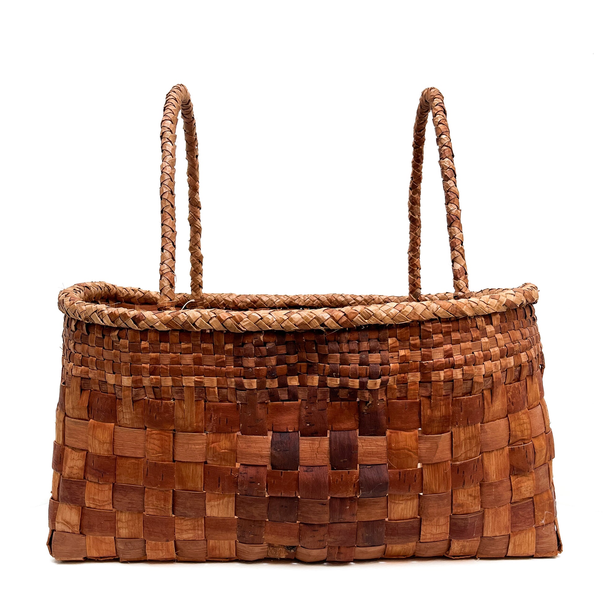 A rectangular woven basket with two handles, showcasing a brown and tan checkered pattern.