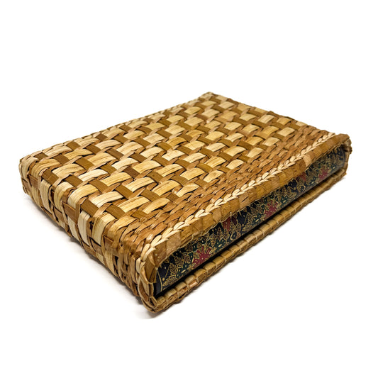 A rectangular woven box with a lid, showing a checkered pattern and a glimpse of patterned fabric inside.
