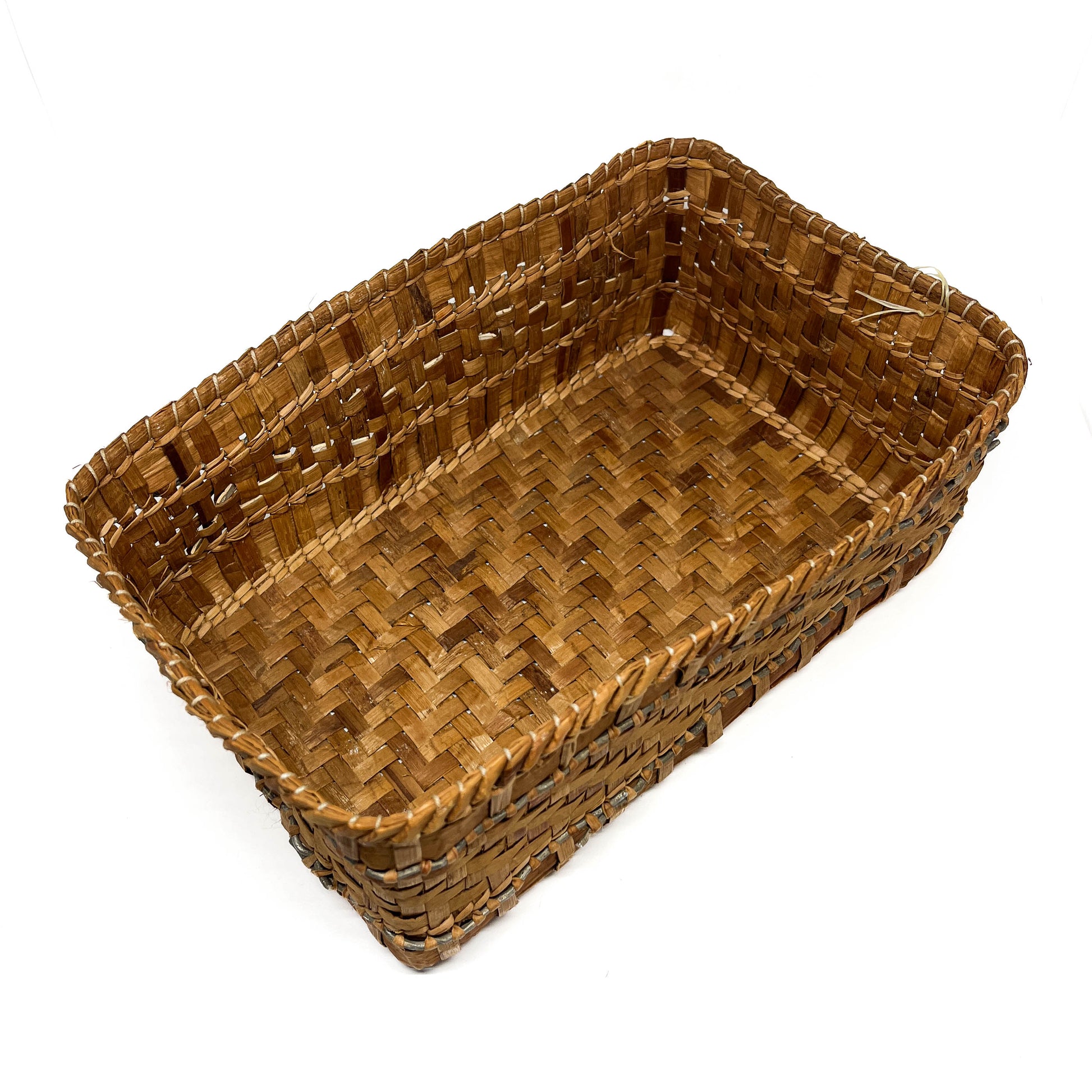 A rectangular woven basket with brown and tan checkered patterns and a gray accent line, viewed from above.