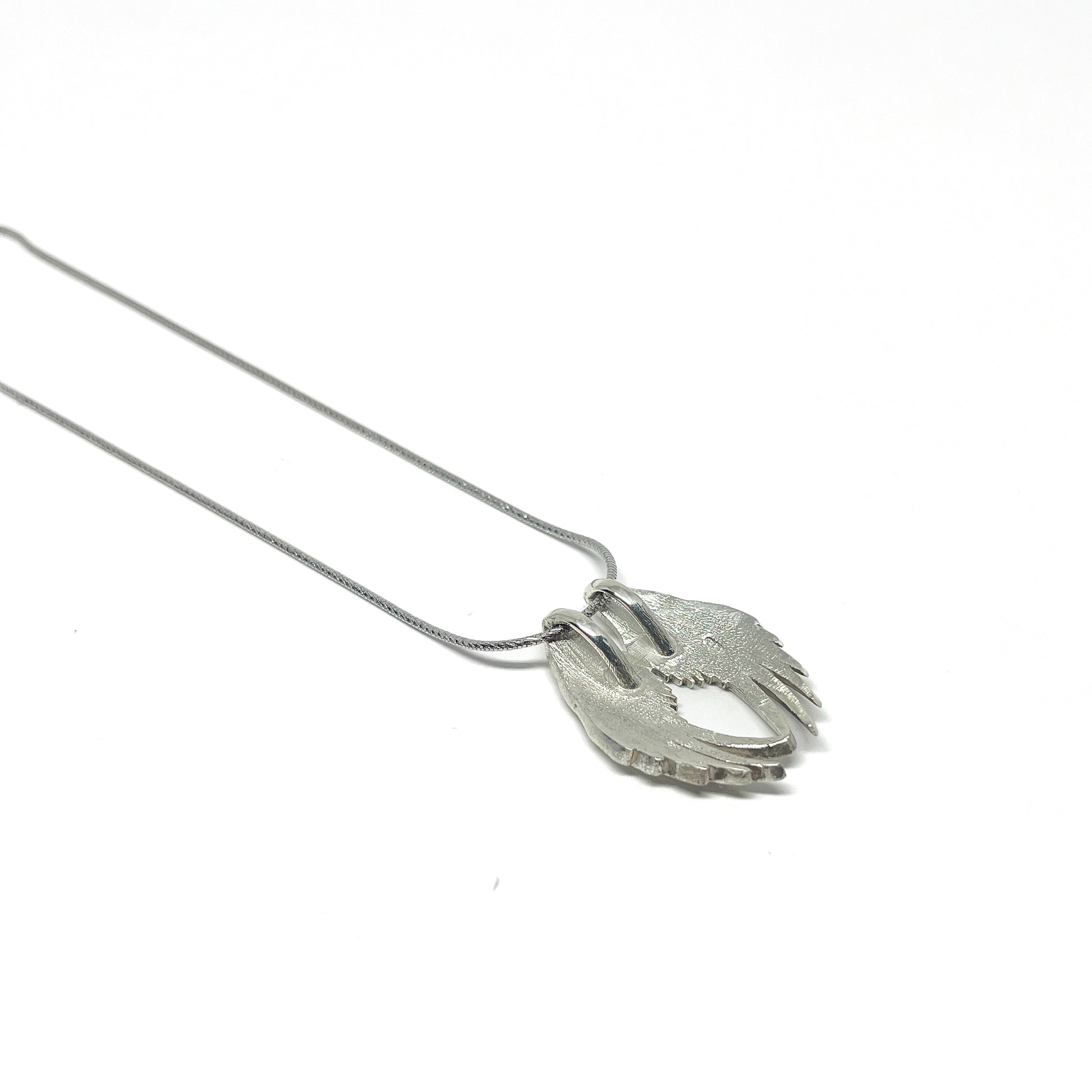 Silver necklace featuring a detailed Angel Wings Pendant with layered feathers on a fine chain.