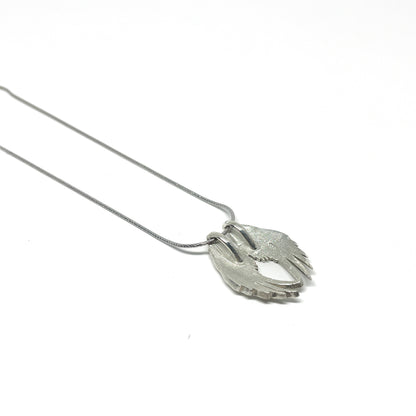 Silver necklace featuring a detailed Angel Wings Pendant with layered feathers on a fine chain.