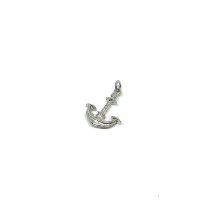 Shiny sterling silver anchor charm with textured details and a small attachment ring.