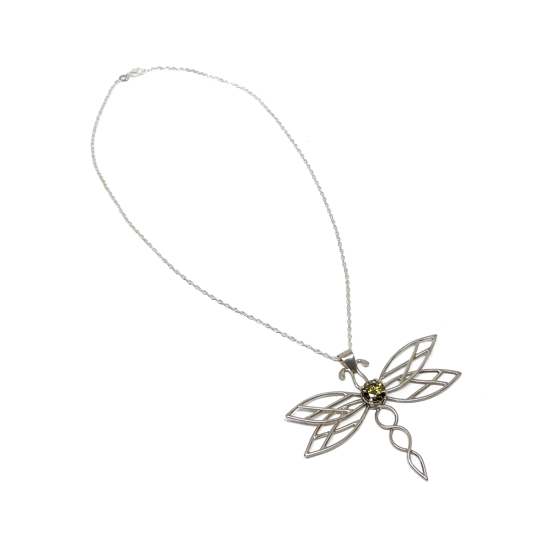 Elegant silver dragonfly pendant necklace displayed on a delicate chain.