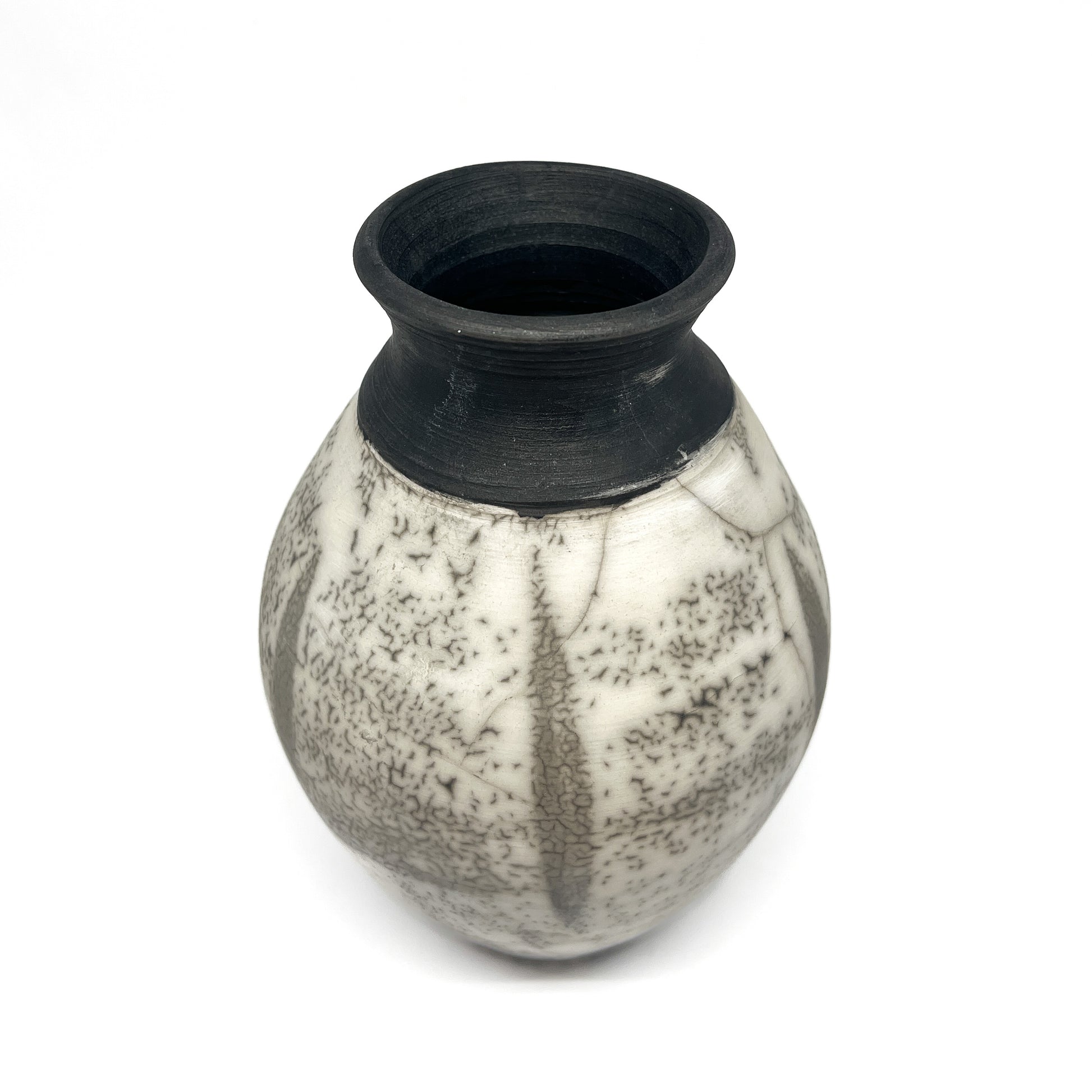 Ceramic vase with a rounded body, short neck, black rim, and crackled black and white glaze.