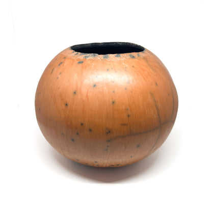 Round ceramic vase with a mottled, earthy-toned glaze and a dark interior.