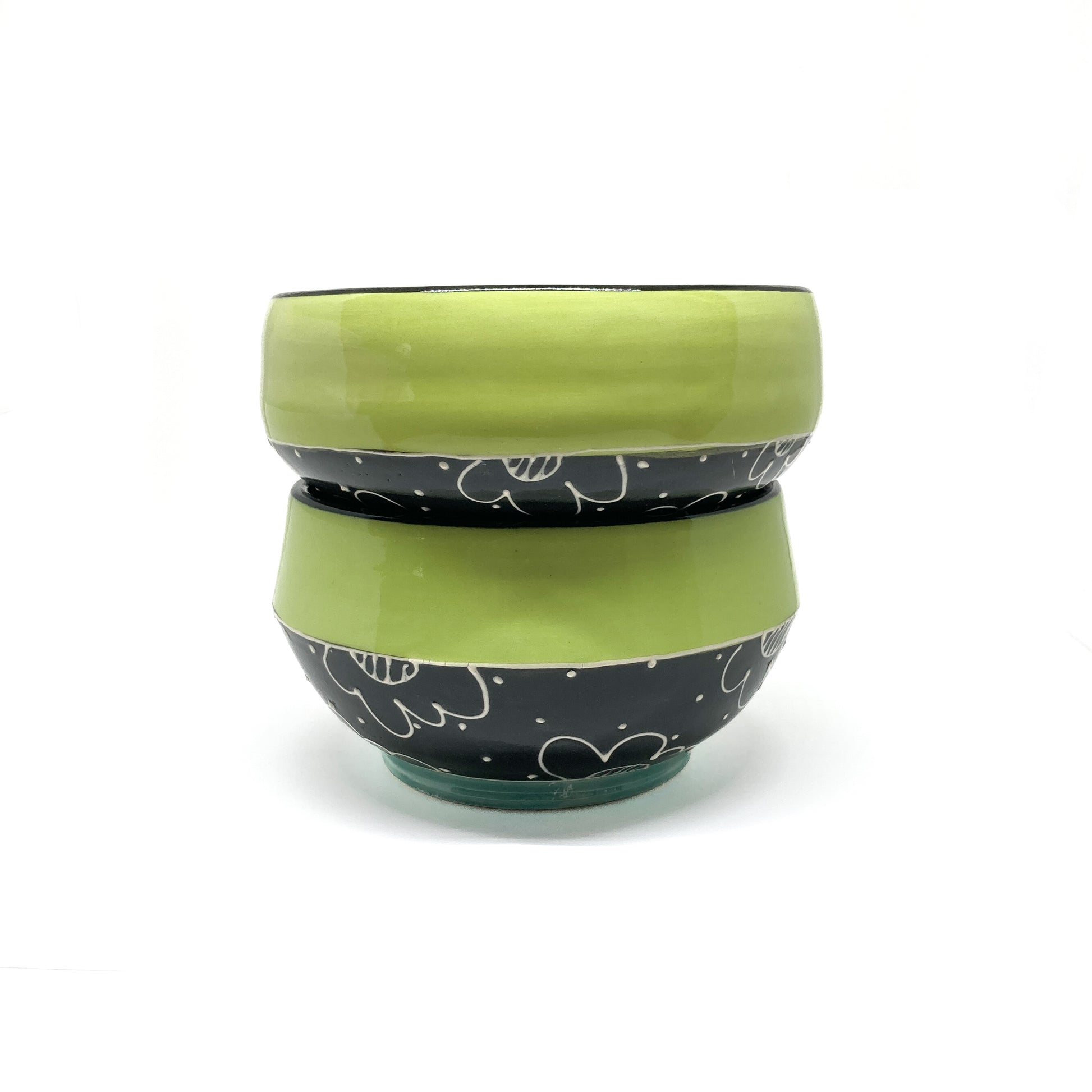 Bottom of the Soup Bowl featuring a signed base and a floral design wrapping around the exterior.
