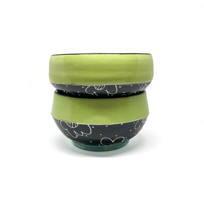 Bottom of the Soup Bowl featuring a signed base and a floral design wrapping around the exterior.