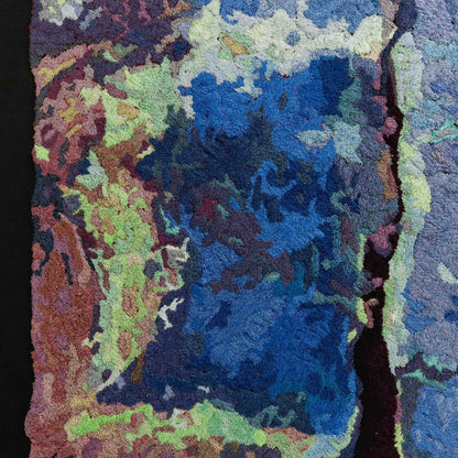 Detailed thread tapestry close-up, showcasing dense, colorful thread stitching in an abstract, textured embroidery.