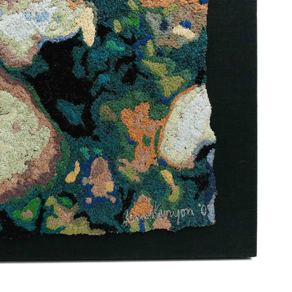 A thread painting with organic shapes, showcasing intricate stitching and colorful thread. 