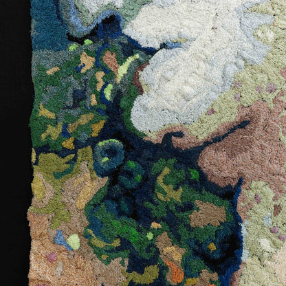 A detailed thread painting with a mix of colorful thread, showing intricate stitching and texture.
