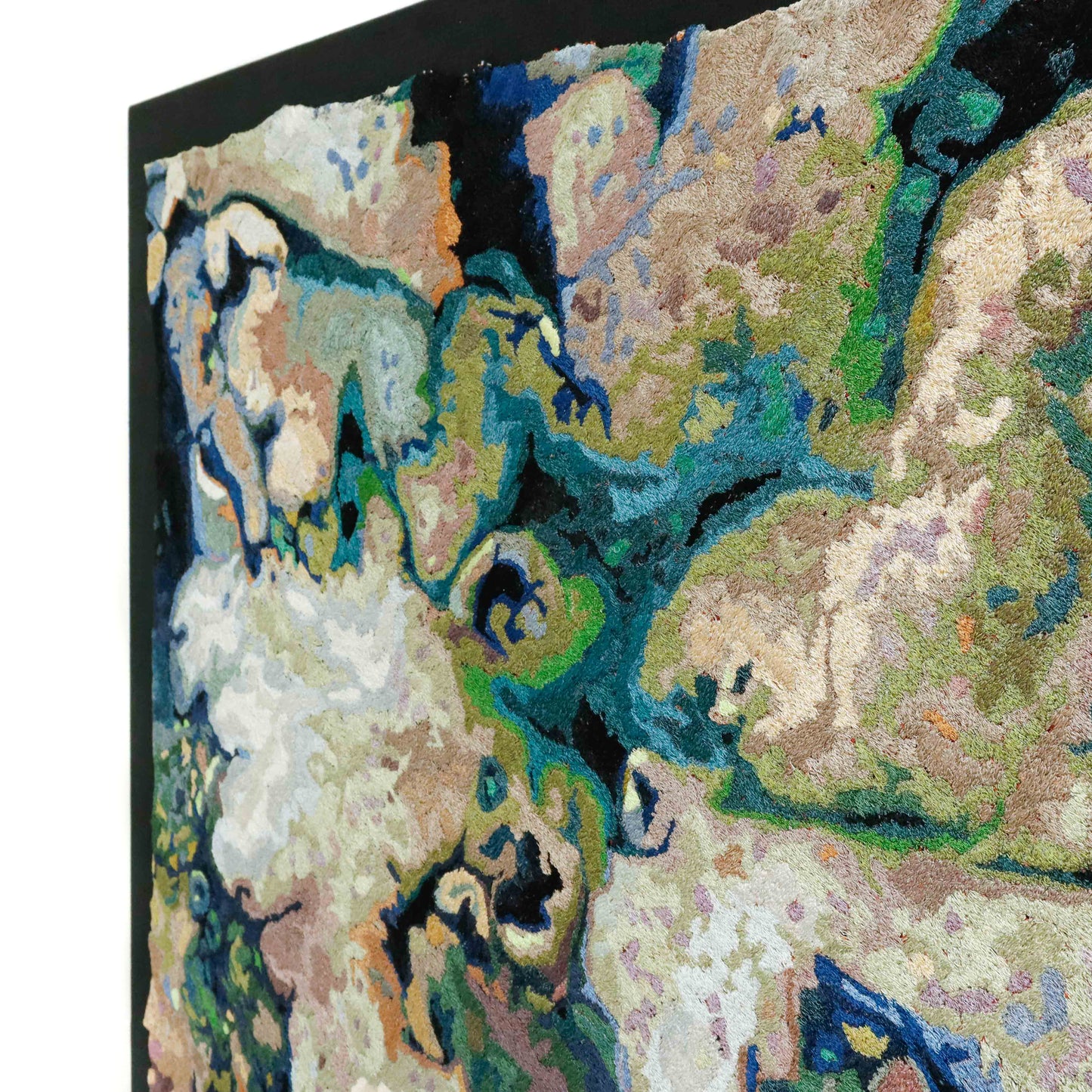 A close-up of a thread painting with organic, textured patterns, showcasing intricate stitching and colorful thread.