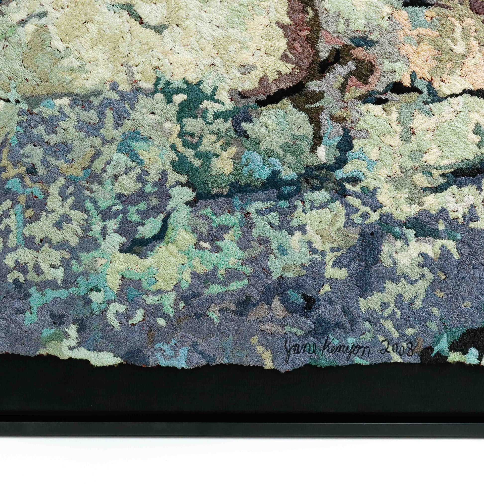 A detailed thread painting with organic, textured patterns, showcasing intricate stitching and colorful thread.