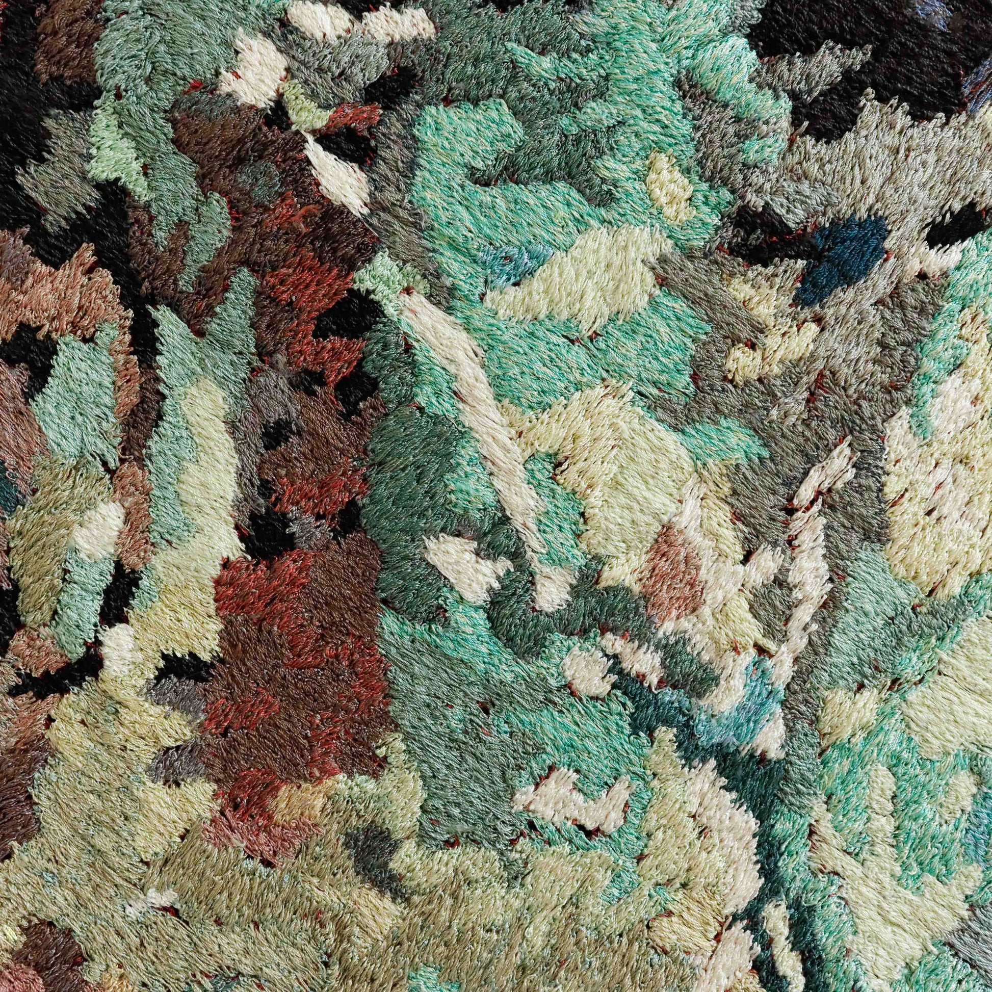 A detailed thread tapestry with a textured, forest-like pattern, showcasing intricate stitching and colorful thread. 