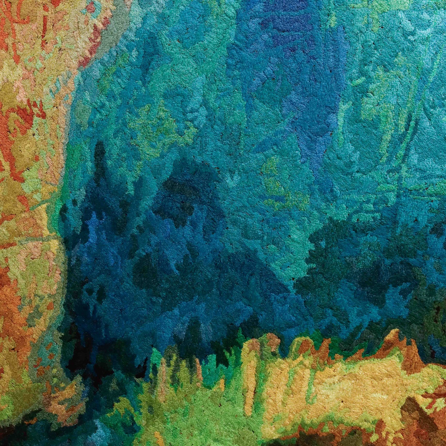 A close-up of a thread tapestry with a textured, abstract design, showcasing intricate stitching and colorful thread.